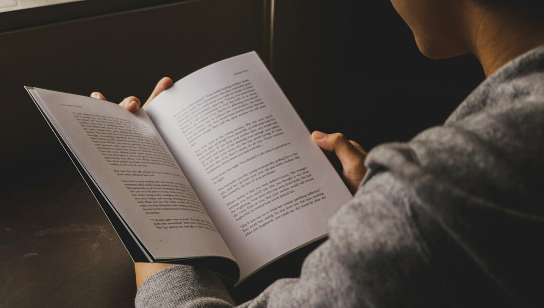 person reading portuguese book
